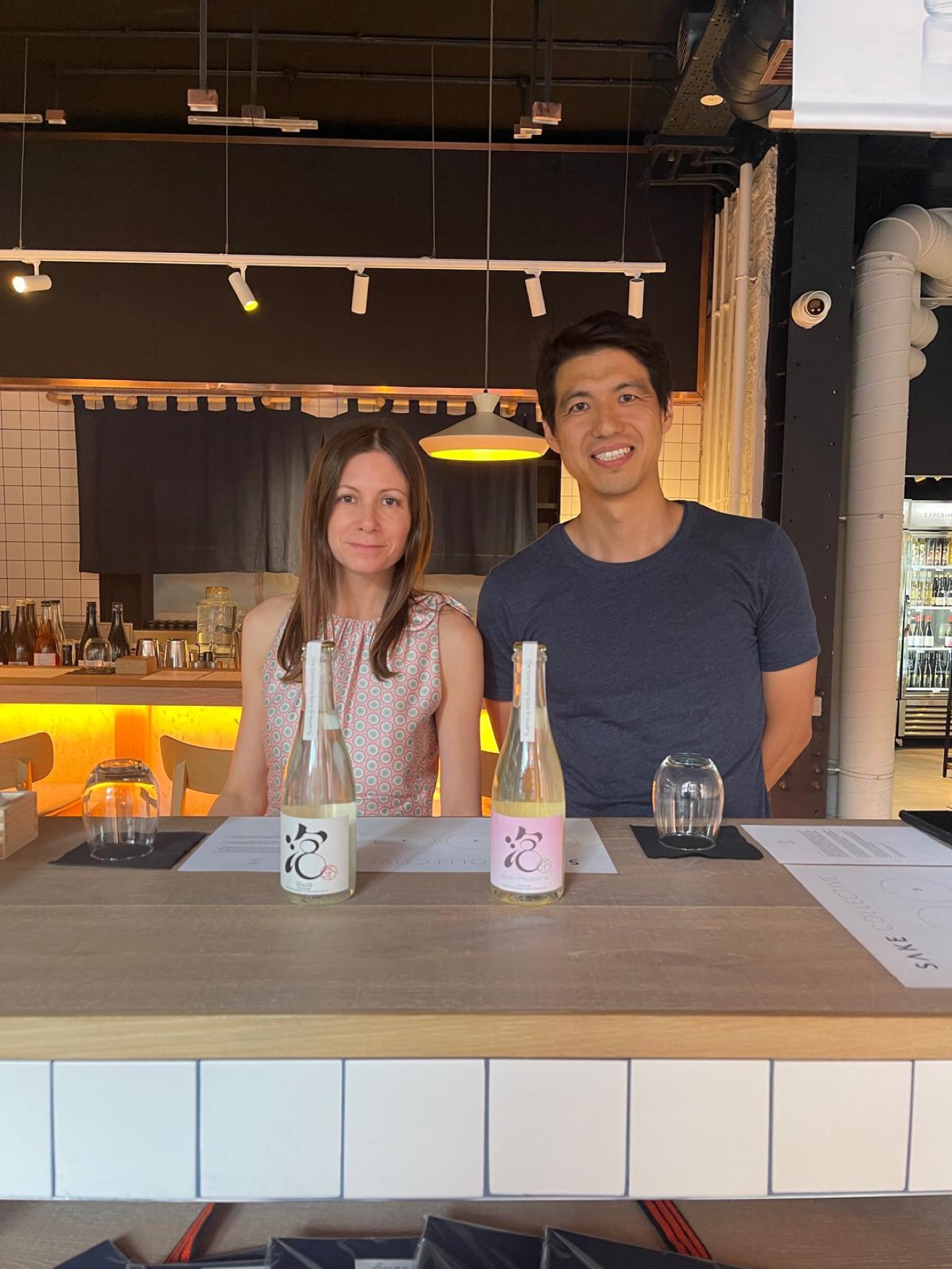 Pouring AWA sparkling sake at the Sake Collective