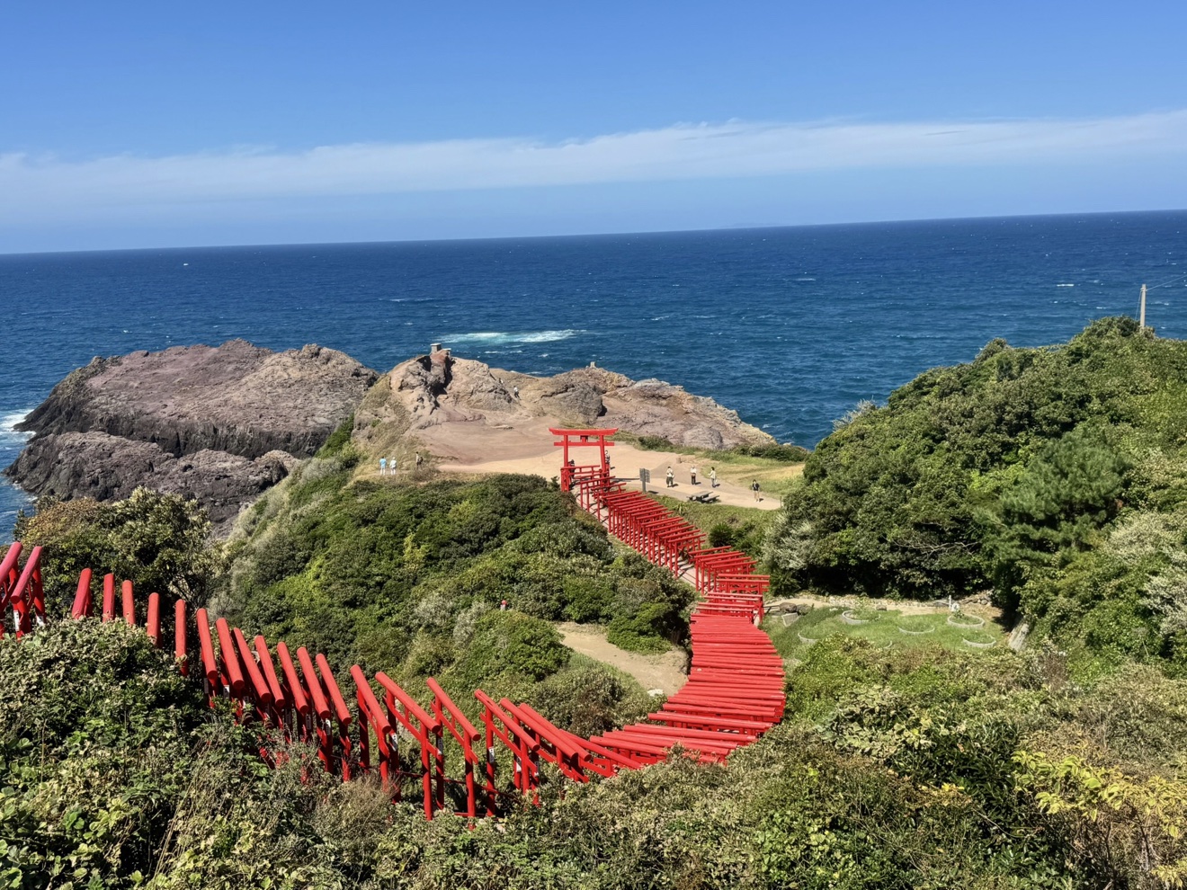 Vermilion torii gates leading down to the sea at Motonosumi Inari, Yamaguchi