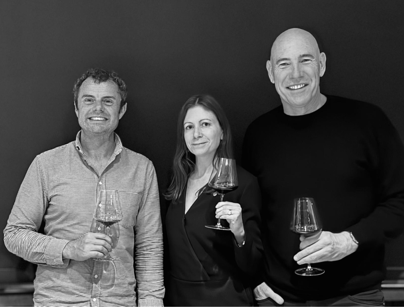 The three Maison V founders standing together, holding wine glasses